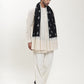Man wearing a black and white pashmina shawl