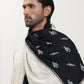Man wearing a black and white pashmina shawl