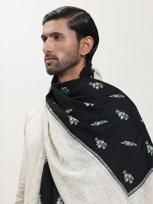 Man wearing a black and white pashmina shawl