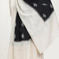 Man wearing a black and white pashmina shawl