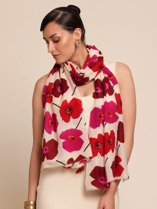 Woman wearing a floral stole with red and pink flowers 