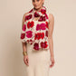 Woman wearing a floral stole with red and pink flowers 