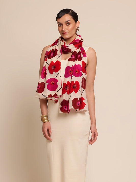 Woman wearing a floral stole with red and pink flowers 