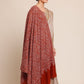 Woman wearing a rust brown pashmina shawl