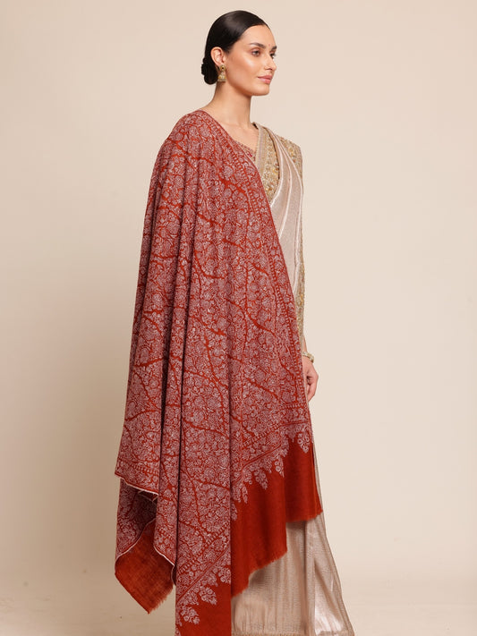 Woman wearing a rust brown pashmina shawl