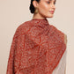 Woman wearing a rust brown pashmina shawl