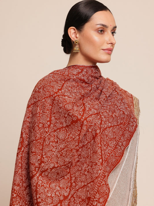 Woman wearing a rust brown pashmina shawl