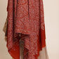 Woman wearing a rust brown pashmina shawl