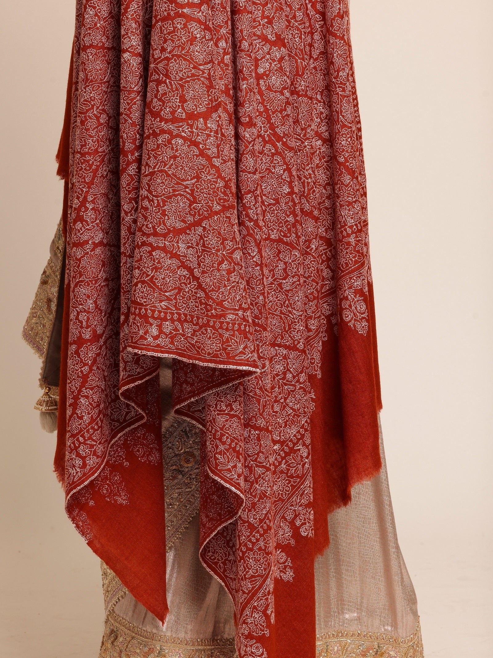 Woman wearing a rust brown pashmina shawl