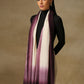 Model is wearing a Saya Ombre stole from Shaza, in the colour Orchid: White and an ombre of light and dark purple. 