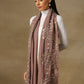 Model is wearing a Vineyard stole in the colour mauve, featuring vine shaped cutwork and zari detailing. 