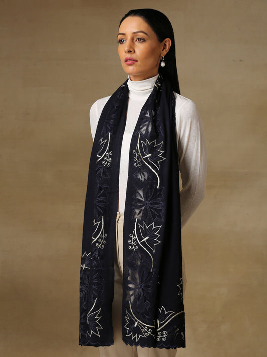 Model is wearing a Vineyard stole in the colour midnight blue, featuring vine shaped cutwork and zari detailing. 