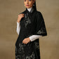 Model is wearing a Vineyard stole in the colour black, featuring vine shaped cutwork and zari detailing. 
