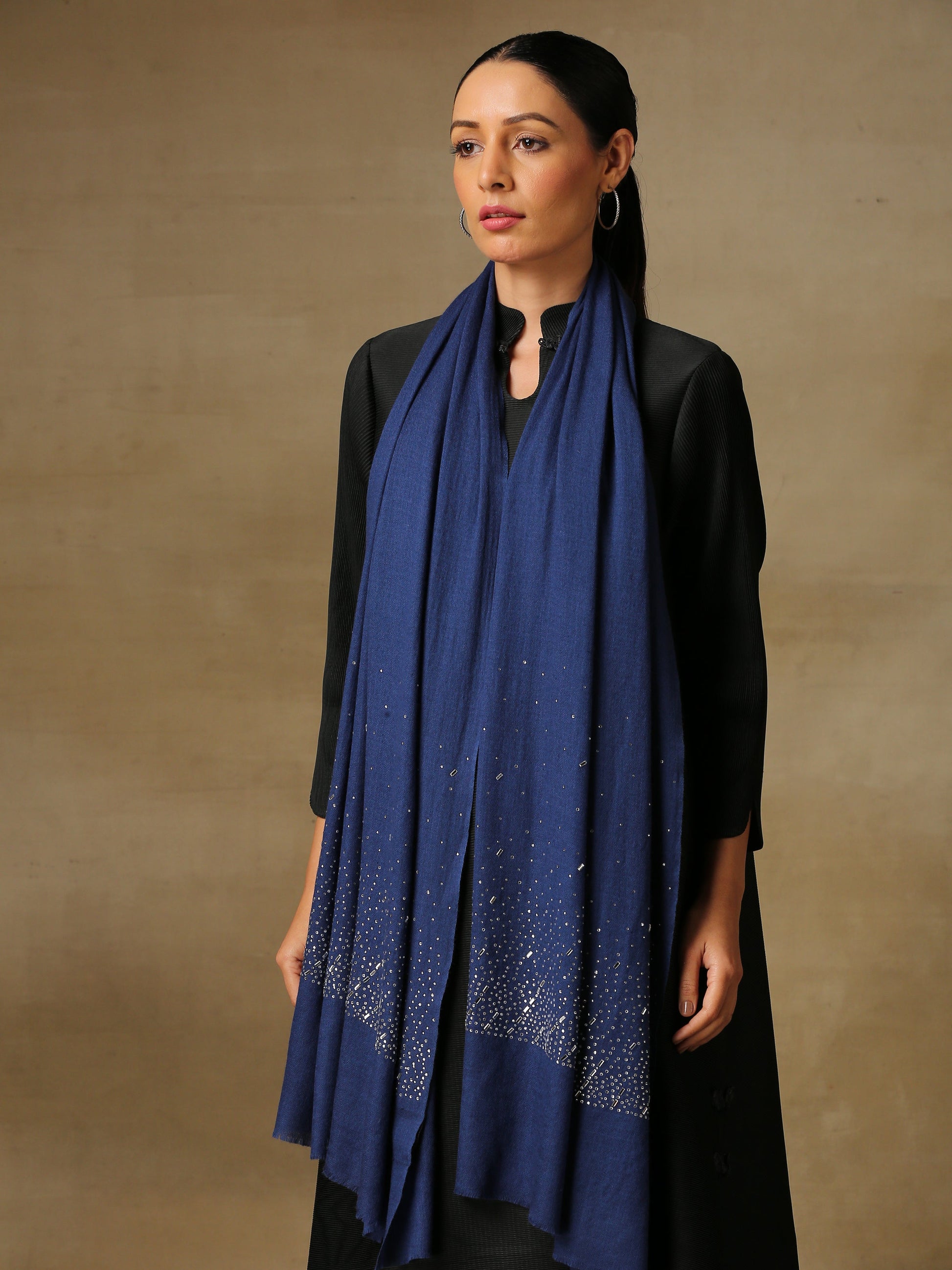 Model is wearing a swarovksi studded Era of Zaywar Palla Stole in the colour navy blue. . 