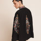 Black cape with colorful embroidery