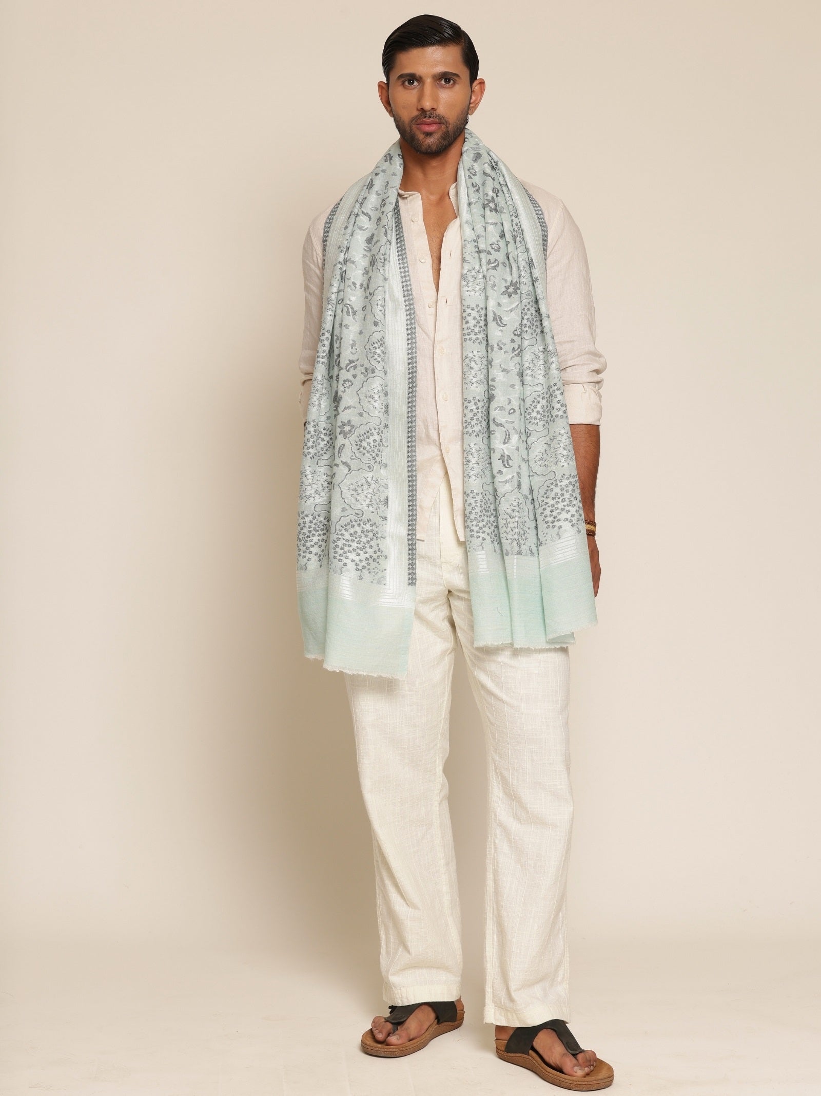 Man wearing a sea green stole