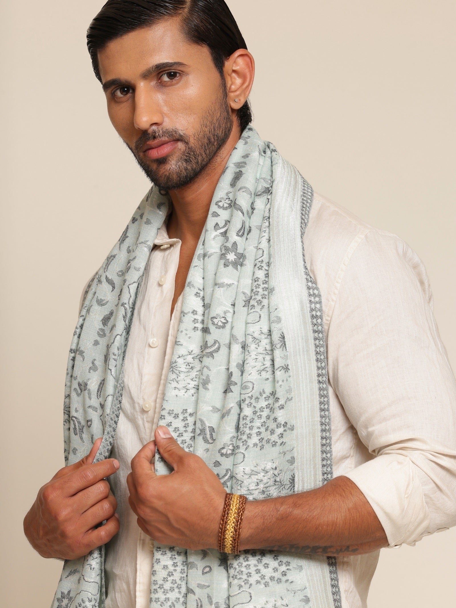 Man wearing a sea green stole