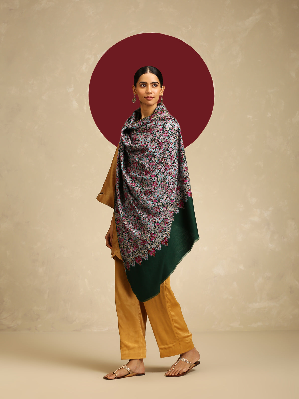 Model is wearing a Needlework pashmina shawl from shaza in a green colour.
