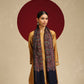 Model is wearing a Needlework pashmina shawl from shaza in midnight blue.