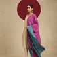 Model is wearing pashmina reversible shawl in pink with blue at the back.