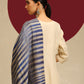 Model is wearing Ekkat reversible stole in a navy with gold zari backing. 