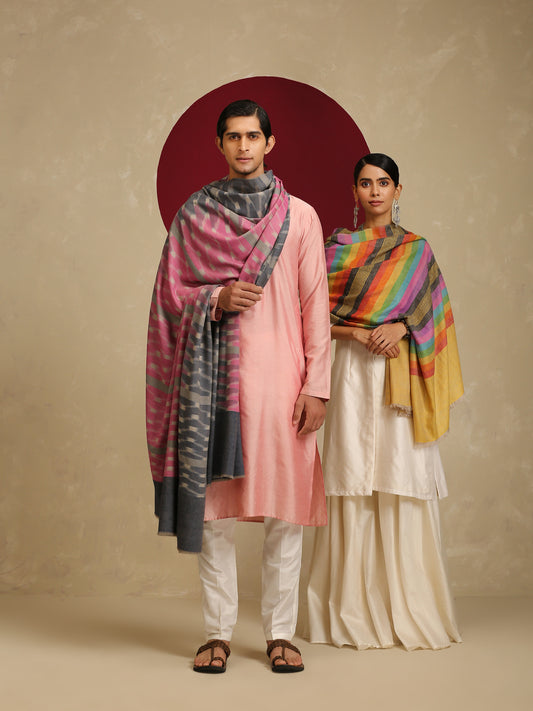 The model on the right is wearing a Pashmina stripe stole from Shaza in a multicoloured stripes pattern on a yellow base. 