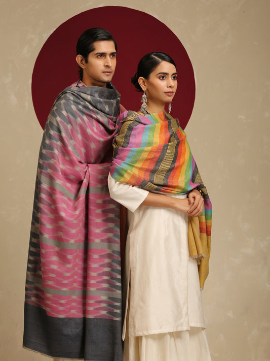 The model on the right is wearing a Pashmina stripe stole from Shaza in a multicoloured stripes pattern on a yellow base. 