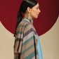 Model is wearing a Pashmina check stole in green and purple stripes.