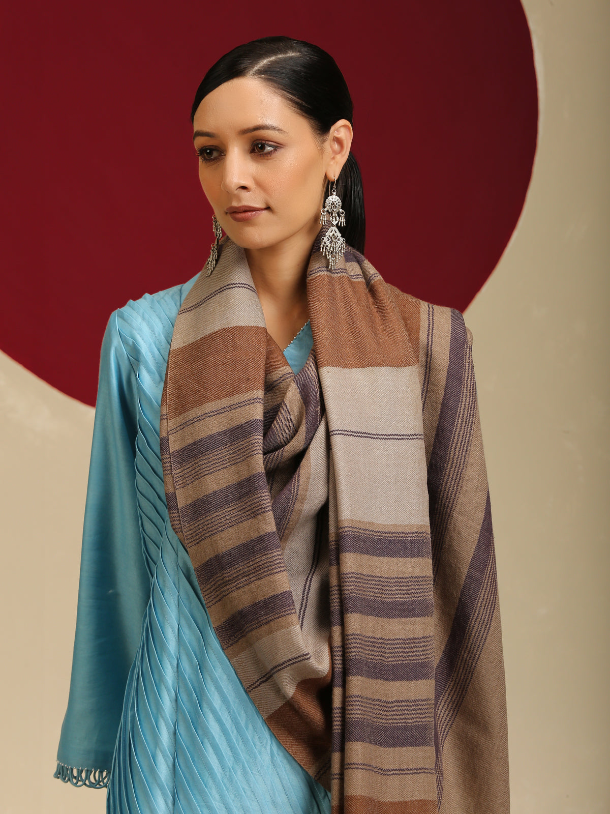 Model is wearing Pashmina check stole in brown and purple stripes.