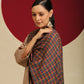 Model is wearing a Pashmina Striped stole from shaza in a multicolour cheques pattern. 