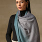 Model is wearing a Pashmina Ombre stole in Self weave in the colour silver. 