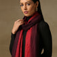 Model is wearing a Pashmina Ombre stole in self weave in the the colours maroon & red. 