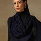 Model is wearing a Velvet Affair stole from Shaza featuring navy blue velvet applique on a navy blue coloured cashmere stole. 