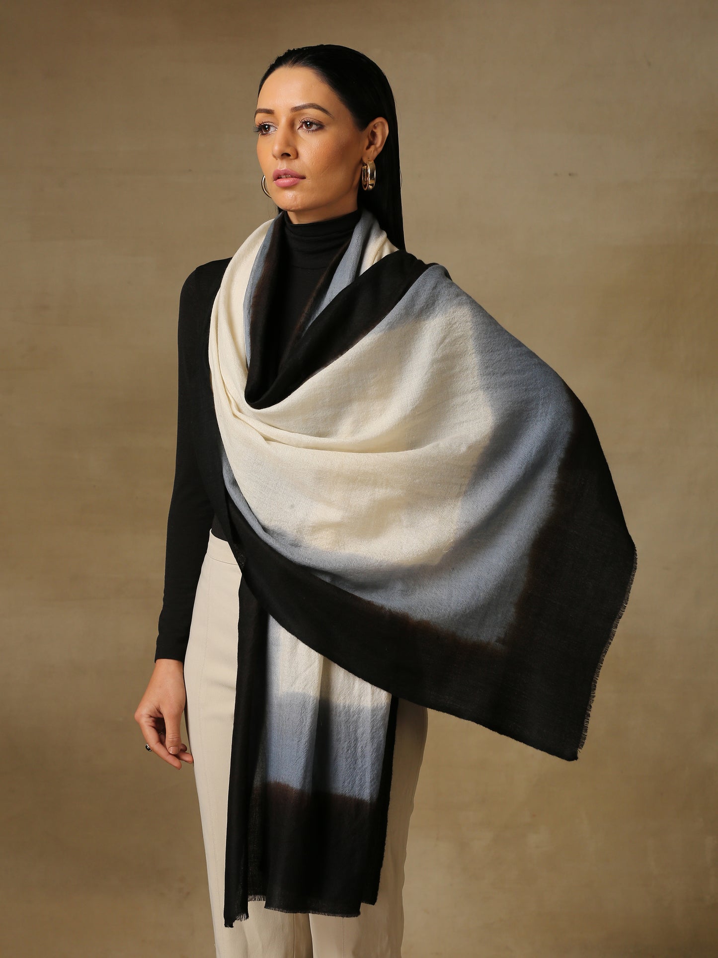 Model is wearing a Saya Ombre stole from Shaza, in the colour caves : White, gray and black