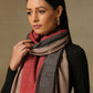 Model is wearing a Pardah stole by Shaza in red and black 
