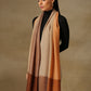 Model is wearing a Pardah stole by Shaza in orange and natural.