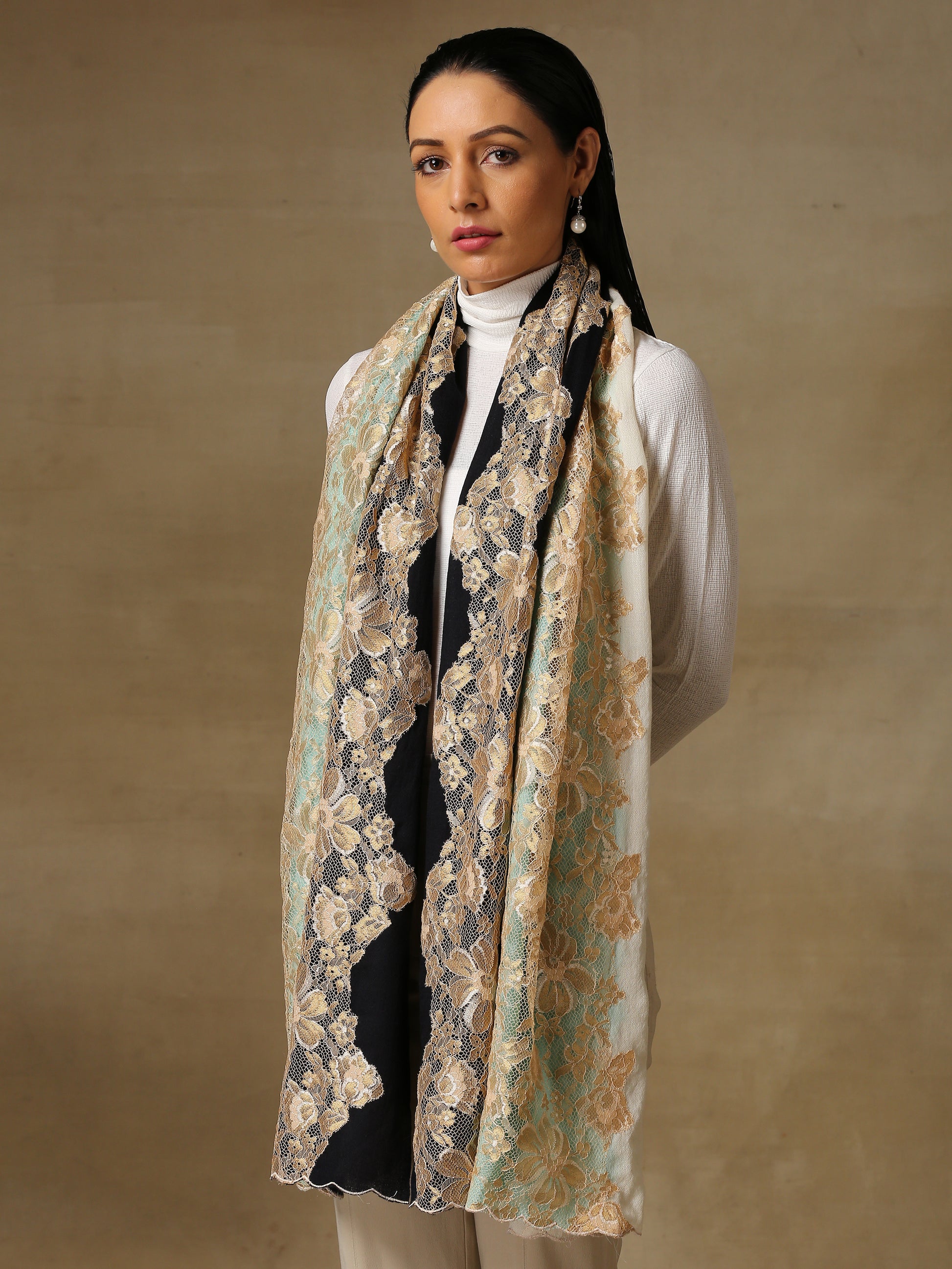 Model is wearing Celestial Chantilly stole from Shaza in ombre of white, black and blue. 