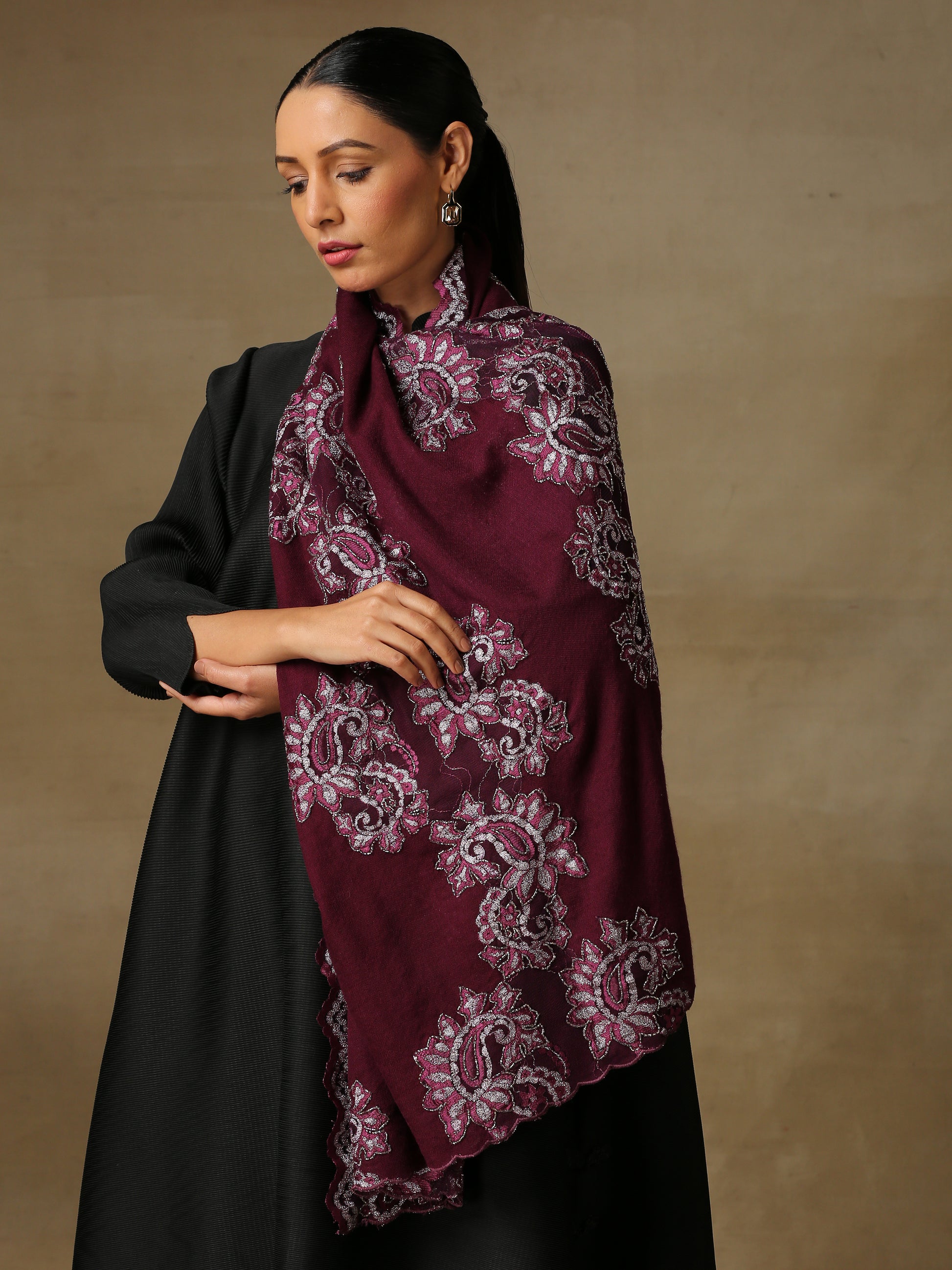 Model is wearing a Chantilly Magnificent stole in the colour Deep Wine from Shaza. 