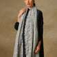 Model is wearing a Celestial Chantilly Zaywar stole from Shaza in silver sky.