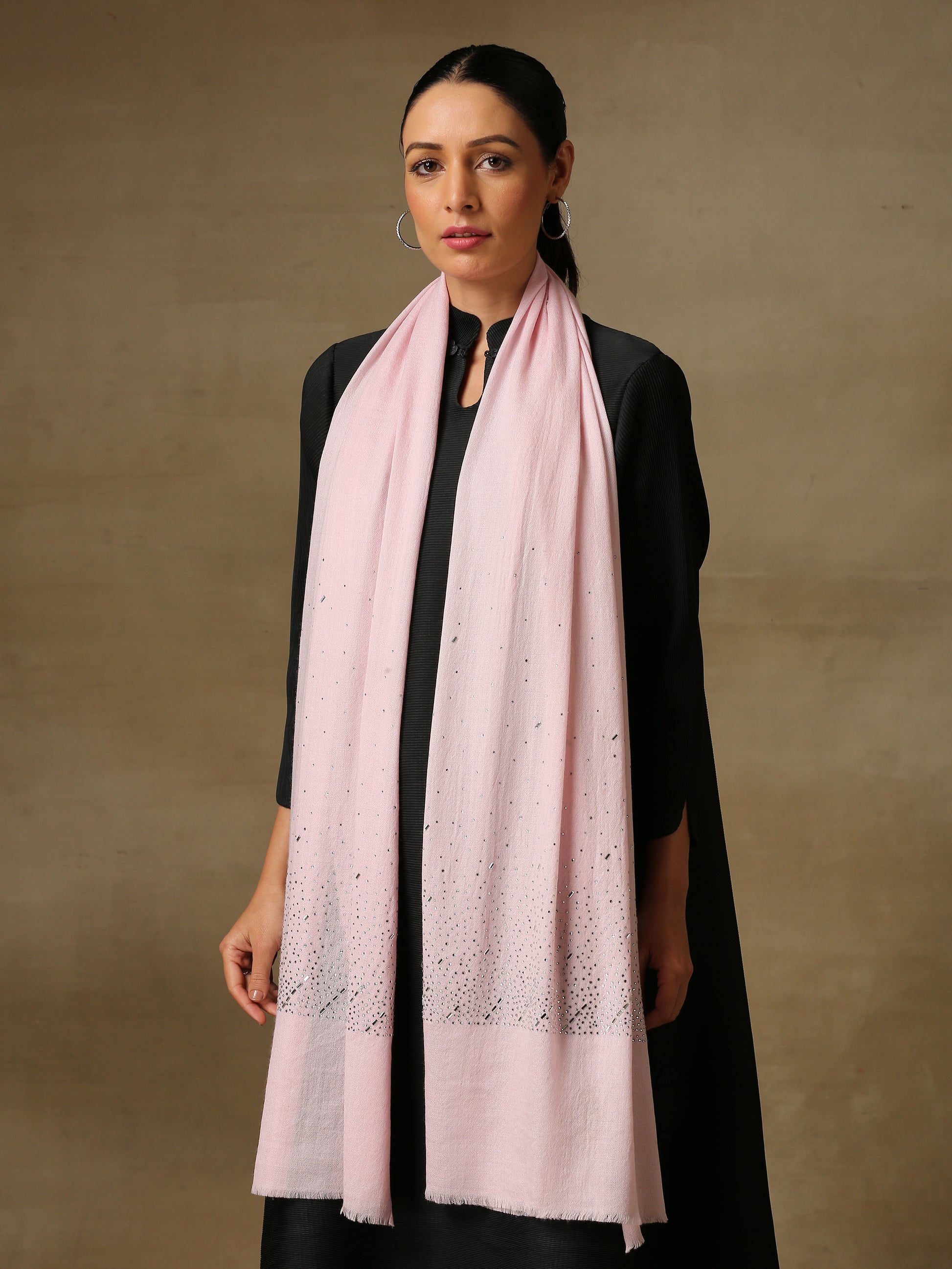Model is wearing a swarovksi studded Era of Zaywar Palla Stole in the colour baby pink. . 
