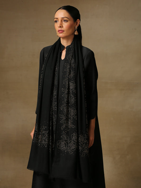 Model is wearing a black stole from the Era of Zaywar Border Swarovski Stole collection, hand embellished with gold swarovski in a roses design